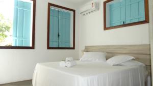 Postel nebo postele na pokoji v ubytování Atobá Villas