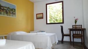 Postel nebo postele na pokoji v ubytování Atobá Villas