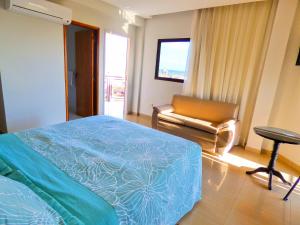 Letto o letti in una camera di De La Costa Hotel