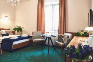 Кровать или кровати в номере Nobilton Hotel