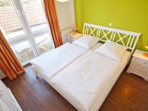 Ein Bett oder Betten in einem Zimmer der Unterkunft Haus Möwe - Apt. 07