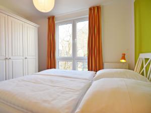 Ein Bett oder Betten in einem Zimmer der Unterkunft Haus Möwe - Apt. 07