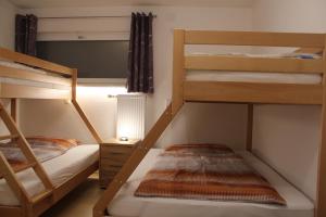 Postel nebo postele na pokoji v ubytování Familienapartment Sunnseitn