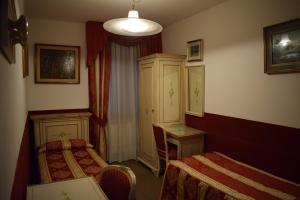 Letto o letti in una camera di Albergo Basilea