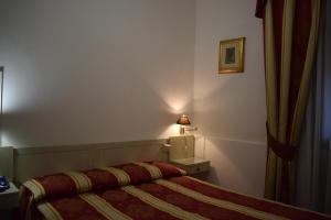 Letto o letti in una camera di Albergo Basilea