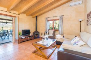 a living room with a couch and a table at Villa VILVAL in Moscari