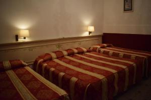 Letto o letti in una camera di Albergo Basilea