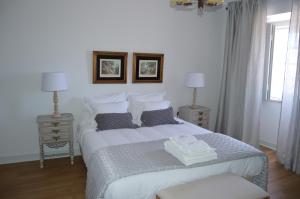 A bed or beds in a room at Quinta do Piloto