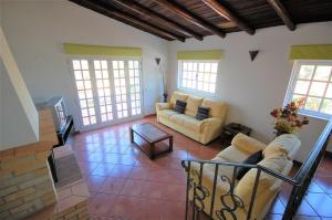 a living room with two couches and a table at Casa da Eira - Private Villa - pool - Free wi-fi - Air Con in Silves