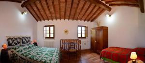 A bed or beds in a room at Villa esclusiva in Toscana con piscina privata