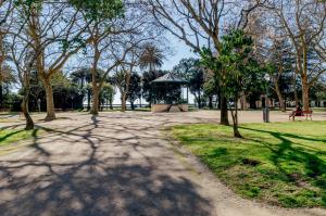 a park with a gazebo and trees and a path at Casa das Laranjas in Porto +53 photos
