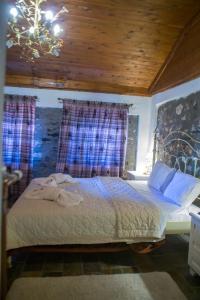 En eller flere senger på et rom på Guesthouse Tsegani