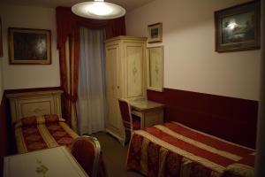 Letto o letti in una camera di Albergo Basilea