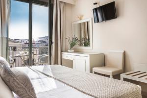 TV a/nebo společenská místnost v ubytování Tourist Boutique Hotel