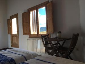 Ένα ή περισσότερα κρεβάτια σε δωμάτιο στο Casa rural La Sabina