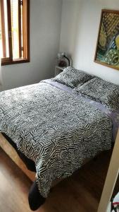 Кровать или кровати в номере Apartamento em Gramado - Vista para o Vale