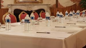 a long table with bottles of water on it at Le Beaugency in Beaugency