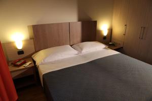 Voodi või voodid majutusasutuse Heraclea Hotel Residence toas