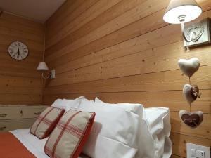 Postel nebo postele na pokoji v ubytování Hotel Pedretti