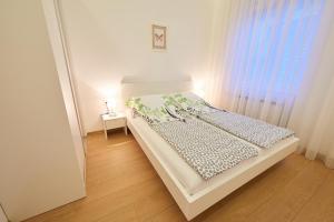 Кровать или кровати в номере Apartments Sarajevo City Hall