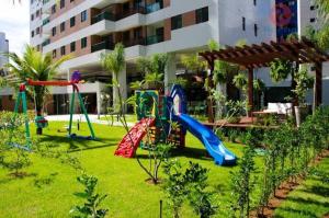 a playground in a park with a slide at Flat Futuro Prince Premium in Recife