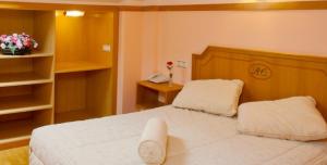 Postel nebo postele na pokoji v ubytování Hotel Río Cabia