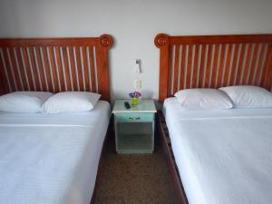 Cama ou camas em um quarto em Blue Coconut Cancun Hotel