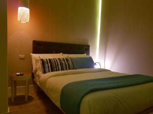 Posteľ alebo postele v izbe v ubytovaní B&B NAPOLI AMORE MIO