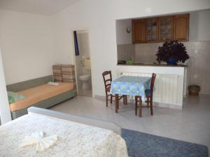 Łóżko lub łóżka w pokoju w obiekcie Apartments Andela