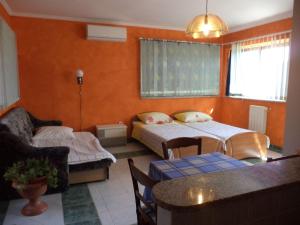 Łóżko lub łóżka w pokoju w obiekcie Apartments Andela