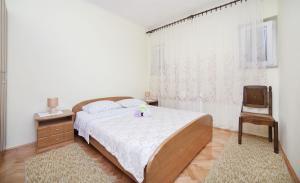 Łóżko lub łóżka w pokoju w obiekcie Apartments Andela