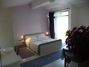 Łóżko lub łóżka w pokoju w obiekcie Apartments Andela