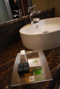 a bathroom sink sitting next to a toilet at Holiday Inn Ankara-Kavaklidere, an IHG Hotel in Ankara