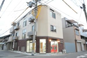 a building on the corner of a street at The Wonder At Stay-Tengachaya- in Osaka