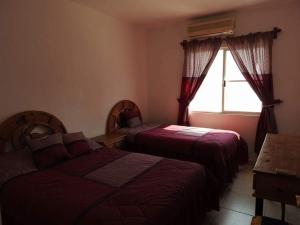 Ένα ή περισσότερα κρεβάτια σε δωμάτιο στο Nuevo Vallarta Casa Neptuno