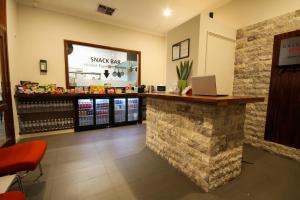 a snack shop with a counter with a laptop on it at Gallery Hotel in Fremantle