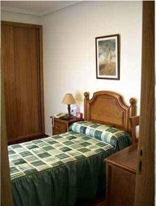 Ein Bett oder Betten in einem Zimmer der Unterkunft Hostal Jalisco