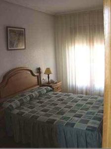 Ein Bett oder Betten in einem Zimmer der Unterkunft Hostal Jalisco