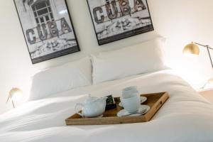 Postel nebo postele na pokoji v ubytování La Ripa Boutique Hotel