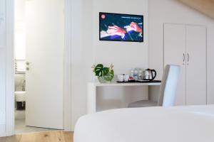 Postel nebo postele na pokoji v ubytování La Ripa Boutique Hotel