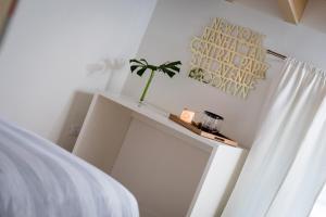 Postel nebo postele na pokoji v ubytování La Ripa Boutique Hotel
