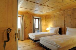 Postel nebo postele na pokoji v ubytování Hotel Müller - mountain lodge
