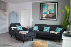 Posezení v ubytování Penthouse "Meerzeit" Kellenhusen mit Strandkorb