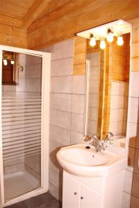 a bathroom with a sink and a shower at Camping Ripolles in Ripoll