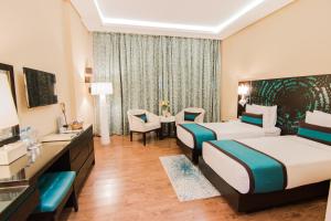 Postel nebo postele na pokoji v ubytování Signature Hotel Al Barsha