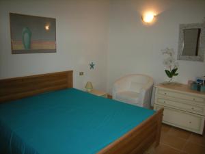 A bed or beds in a room at Mare & Mirice - Case Appartamenti Vacanza
