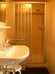 a bathroom with a shower and a sink and a sink at Rifugio Bernhard in Obernussdorf