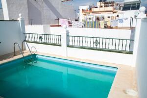 a swimming pool on the side of a cruise ship at Easy Nerja Apartments in Nerja