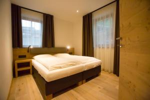 Posteľ alebo postele v izbe v ubytovaní Rofenhof