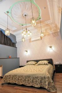 a bedroom with a large bed in a room at Мини-Отель "Навруз" in Kharkiv